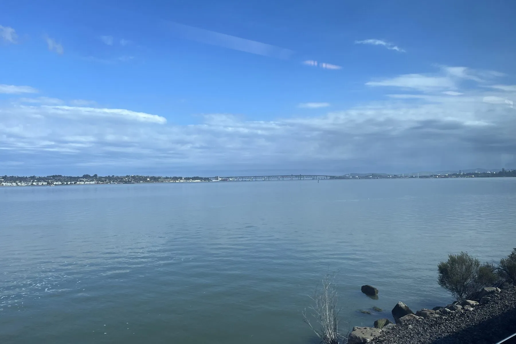The Carquinez Strait seen from the Martinez shoreline, with the far bank low on the horizon.