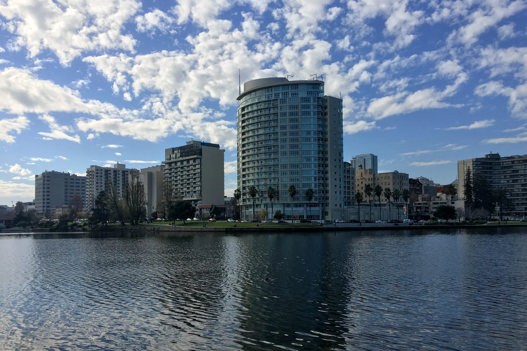 Lake Merritt in Oakland, with the round tower of the Lakeside Apartments district across the water.